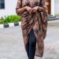 Ìtura draped tunic in brown check, worn over black jeans, front view