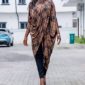 Ìtura draped tunic in brown check, full-length walking view