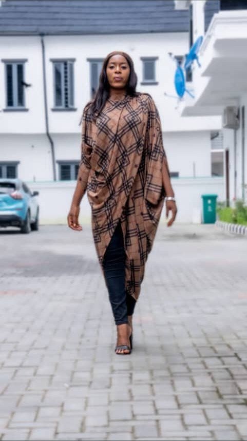 Ìtura draped tunic in brown check, full-length walking view