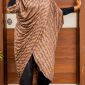 Ìtura draped tunic in brown script print, worn with black wide-leg trousers